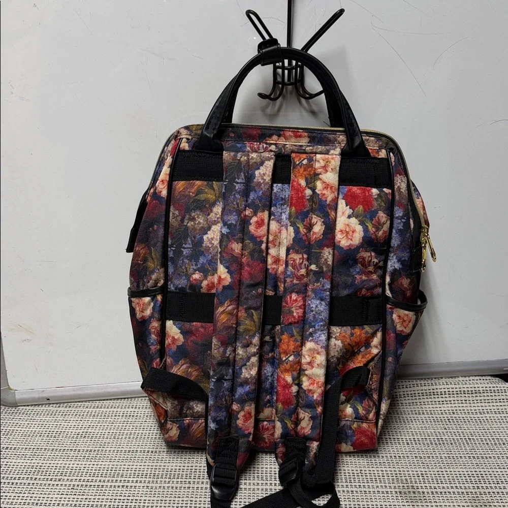 KROSER laptop backpack featuring a dark floral pattern